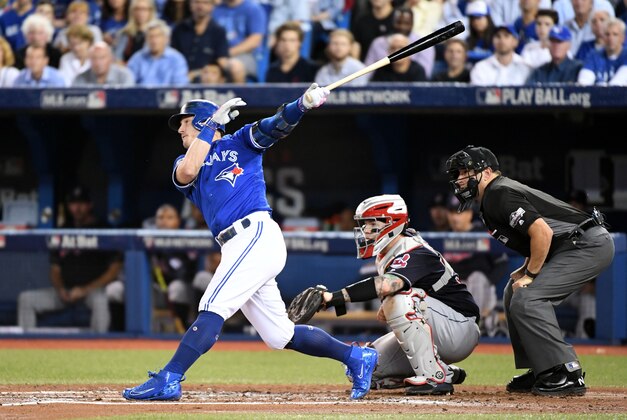 Oct 18, 2016; Toronto, Ontario, CAN; Toronto Blue Jays third baseman Josh Donaldson (20) hits a solo home run during the third inning against the Cleveland Indians in game four of the 2016 ALCS playoff baseball series at Rogers Centre. Mandatory Credit: Nick Turchiaro-USA TODAY Sports