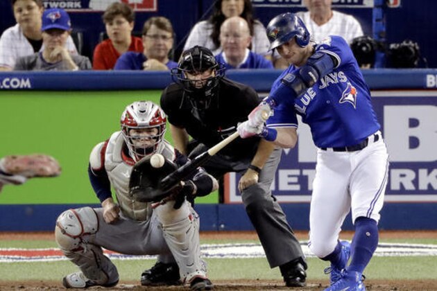 Toronto Blue Jays' Josh Donaldson hits a home run against the Cleveland Indians during the third inning in Game 4 of baseball's American League Championship Series in Toronto, Tuesday, Oct. 18, 2016. (AP Photo/Charlie Riedel)