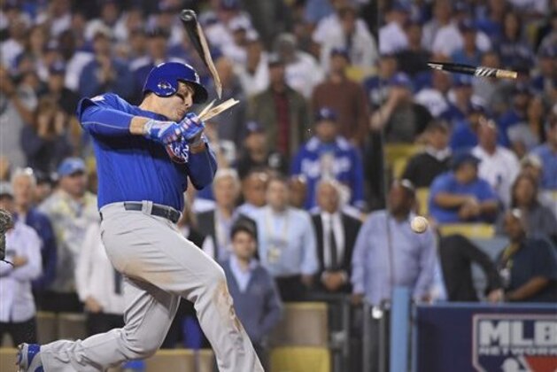 Chicago Cubs' Anthony Rizzo breaks his bat as he hits a single during the ninth inning of Game 3 of the National League baseball championship series against the Los Angeles Dodgers Tuesday, Oct. 18, 2016, in Los Angeles. (AP Photo/Mark J. Terrill)