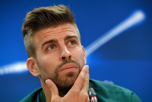 Barcelona's defender Gerard Pique looks on during a press conference at the Sports Center FC Barcelona Joan Gamper in Sant Joan Despi, near Barcelona on October 18, 2016, on the eve of the UEFA Champions League football match FC Barcelona vs Manchester City. / AFP / LLUIS GENE        (Photo credit should read LLUIS GENE/AFP/Getty Images)