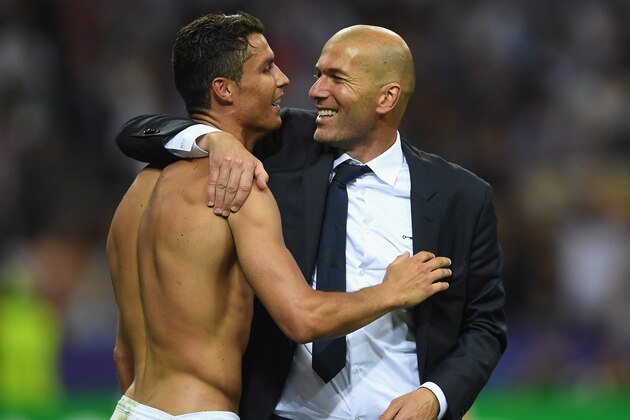 MILAN, ITALY - MAY 28:  Cristiano Ronaldo of Real Madrid celebrates with head coach Zinedine Zidane after victory in the UEFA Champions League Final match between Real Madrid and Club Atletico de Madrid at Stadio Giuseppe Meazza on May 28, 2016 in Milan, Italy.  (Photo by Laurence Griffiths/Getty Images)
