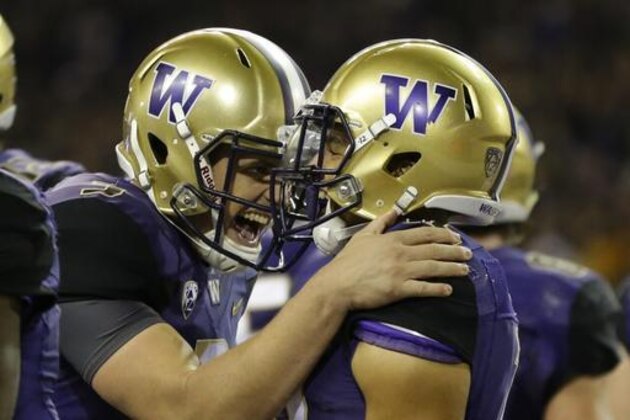 FILE - In this Sept. 30, 2016, file photo, Washington quarterback Jake Browning, left, celebrates with wide receiver Aaron Fuller after Fuller caught a pass from Browning for a touchdown in the second half of an NCAA college football game, in Seattle. The Huskies are coming off smashing Stanford and have a top-five ranking for the first time since the end of the 2001 season. They even get a little extra rest having played last Friday night. Meanwhile, the Oregon Ducks are on their first three-game losing streak since 2007. This looks like a mismatch in the Huskies favor, despite what recent history suggests. (AP Photo/Ted S. Warren, File)