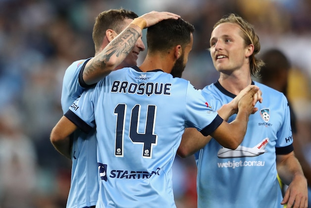 SYDNEY, AUSTRALIA - OCTOBER 15:  Alex Brosque of Sydney FC is congratulated by team mates after scoring a goal during the round two A-League match between Sydney FC and the Central Coast Mariners at Allianz Stadium on October 15, 2016 in Sydney, Australia.  (Photo by Cameron Spencer/Getty Images)