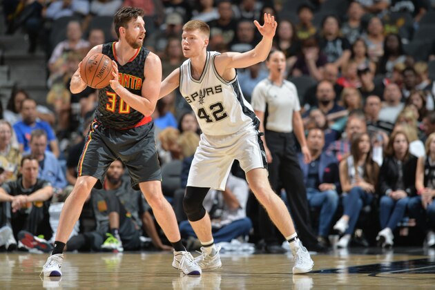 SAN ANTONIO, TX - OCTOBER 8 : Ryan Kelly #30 of the Atlanta Hawks handles the ball against Davis Bertans #42 of the San Antonio Spurs on October 8, 2016 at the AT&T Center in San Antonio, Texas. NOTE TO USER: User expressly acknowledges and agrees that, by downloading and or using this photograph, user is consenting to the terms and conditions of the Getty Images License Agreement. Mandatory Copyright Notice: Copyright 2016 NBAE (Photos by Mark Sobhani/NBAE via Getty Images)
