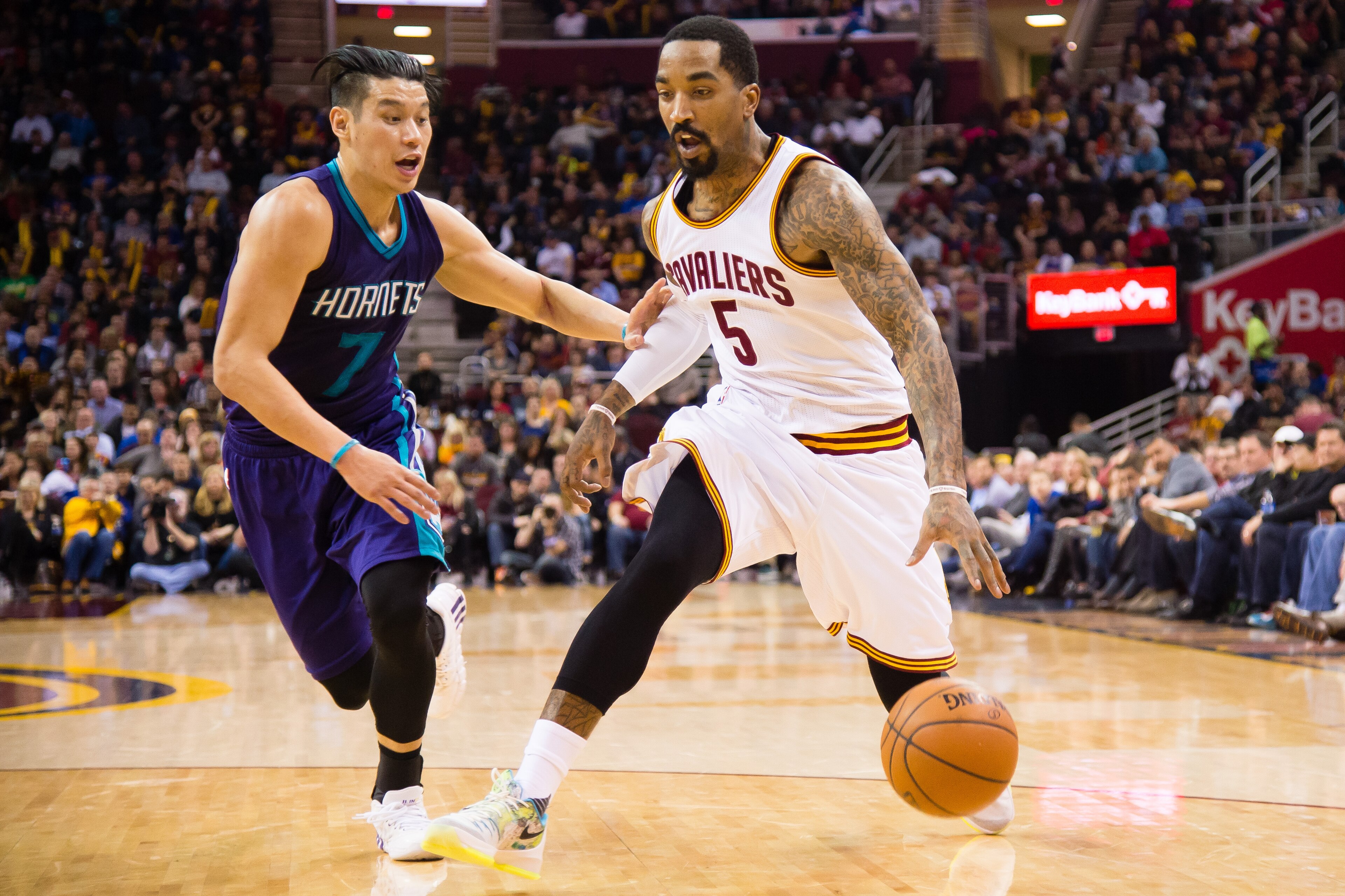 CLEVELAND, OH - FEBRUARY 24: Jeremy Lin #7 of the Charlotte Hornets guards J.R. Smith #5 of the Cleveland Cavaliers during the first half at Quicken Loans Arena on February 18, 2016 in Cleveland, Ohio. NOTE TO USER: User expressly acknowledges and agrees that, by downloading and/or using this photograph, user is consenting to the terms and conditions of the Getty Images License Agreement. Mandatory copyright notice. (Photo by Jason Miller/Getty Images)