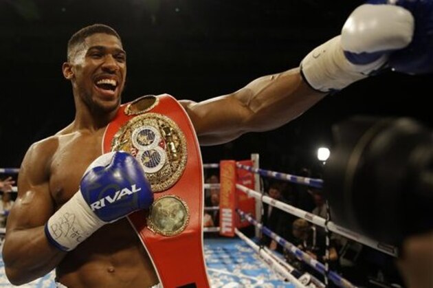 British boxer Anthony Joshua celebrates after winning the IBF heavyweight title bout between US boxer Charles Martin and British boxer Anthony Joshua at the O2 Arena in London, Saturday, April 9, 2016.(AP Photo/Matt Dunham)