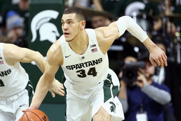 Jan 31, 2016; East Lansing, MI, USA; Michigan State Spartans forward Gavin Schilling (34) brings the ball up court against the Rutgers Scarlet Knights during the second half of a game at Jack Breslin Student Events Center. Mandatory Credit: Mike Carter-USA TODAY Sports