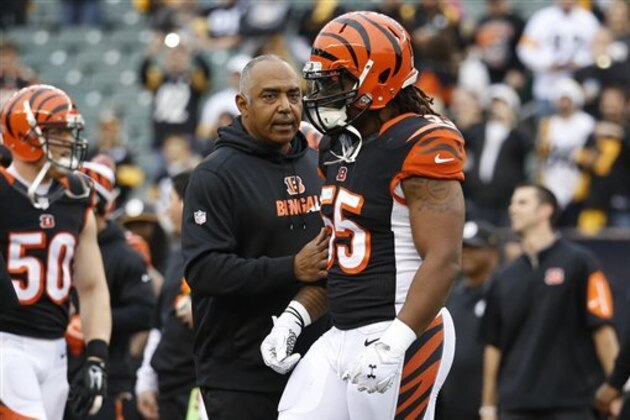 Cincinnati Bengals head coach Marvin Lewis, center, speaks with outside linebacker Vontaze Burfict (55) after a scrum broke out in midfield during practice before an NFL football game against the Pittsburgh Steelers, Sunday, Dec. 13, 2015, in Cincinnati. (AP Photo/Frank Victores)
