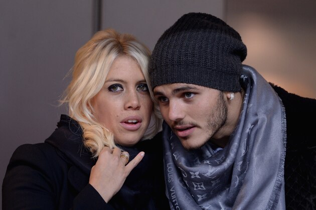 MILAN, ITALY - JANUARY 13:  Wanda Nara and Mauro Icardi attend the Serie A match between FC Internazionale Milano and AC Chievo Verona at San Siro Stadium on January 13, 2014 in Milan, Italy.  (Photo by Claudio Villa/Getty Images)