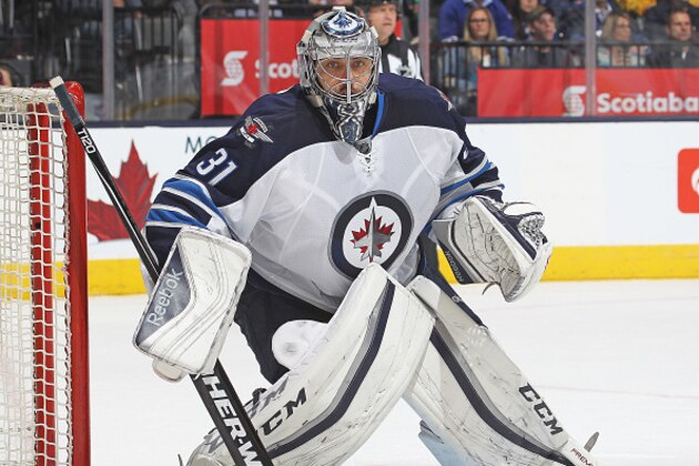 TORONTO, ON - NOVEMBER 4:  Ondrej Pavelec #31 of the Winnipeg Jets watches the corner against the Toronto Maple Leafs during an NHL game at the Air Canada Centre on November 4, 2015 in Toronto, Ontario, Canada. The Jets defeated the Maple Leafs 4-2. (Photo by Claus Andersen/Getty Images)