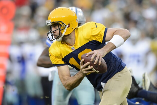 GREEN BAY, WI - OCTOBER 16: Aaron Rodgers #12 of the Green Bay Packers scrambles with the ball against the Dallas Cowboys during the game on October 16, 2016 at Lambeau Field in Green Bay, Wisconsin. The Cowboys defeated the Packers 30-16. (Photo by Hannah Foslien/Getty Images)