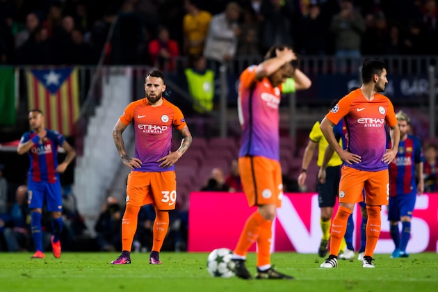 BARCELONA, SPAIN - OCTOBER 19: Nicolas Otamendi (L) and Ilkay Gundogan (R) of Manchester City FC look dejected after FC Barcelona scored a goal during the UEFA Champions League group C match between FC Barcelona and Manchester City FC at Camp Nou on October 19, 2016 in Barcelona, Spain. (Photo by Alex Caparros/Getty Images)