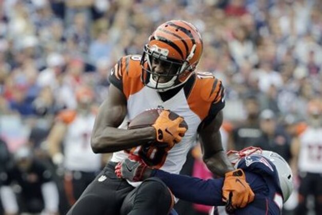 New England Patriots defensive back Duron Harmon, right, tackles Cincinnati Bengals wide receiver A.J. Green during the first half of an NFL football game, Sunday, Oct. 16, 2016, in Foxborough, Mass. (AP Photo/Elise Amendola)