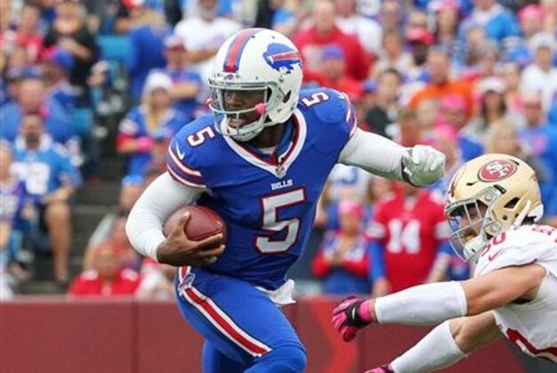 Buffalo Bills quarterback Tyrod Taylor (5) breaks a tackle against the San Francisco 49ers during the second half of an NFL football game on Sunday, Oct. 16, 2016, in Orchard Park, N.Y. (AP Photo/Bill Wippert)