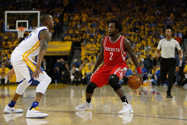 OAKLAND, CA - APRIL 18: Patrick Beverley #2 of the Houston Rockets is guarded by Andre Iguodala #9 of the Golden State Warriors in the second quarter in Game Two of the Western Conference Quarterfinals during the 2016 NBA Playoffs at ORACLE Arena on April 18, 2016 in Oakland, California. NOTE TO USER: User expressly acknowledges and agrees that, by downloading and or using this photograph, user is consenting to the terms and conditions of Getty Images License Agreement. (Photo by Lachlan Cunningham/Getty Images)