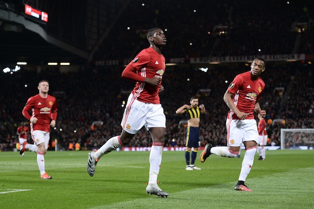 Manchester United's French midfielder Paul Pogba (C) celebrates scoring their first goal from the penalty spot during the UEFA Europa League group A football match between Manchester United and Fenerbahce at Old Trafford in Manchester, north west England, on October 20, 2016. / AFP / OLI SCARFF        (Photo credit should read OLI SCARFF/AFP/Getty Images)