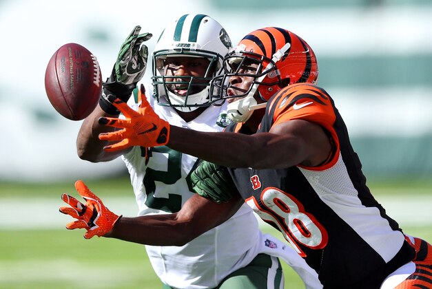 Sep 11, 2016; East Rutherford, NJ, USA; Cincinnati Bengals wide receiver A.J. Green (18) catches a pass in front of New York Jets corner back Darrelle Revis (24) during the fourth quarter at MetLife Stadium. Mandatory Credit: Brad Penner-USA TODAY Sports