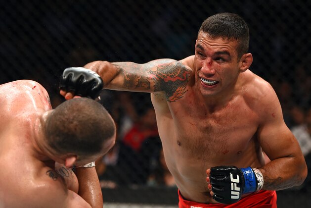 MEXICO CITY, MEXICO - JUNE 13: (R-L) Fabricio Werdum punches Cain Velasquez in their UFC heavyweight championship bout during the UFC 188 event inside the Arena Ciudad de Mexico on June 13, 2015 in Mexico City, Mexico. (Photo by Josh Hedges/Zuffa LLC/Zuffa LLC via Getty Images) MEXICO CITY, MEXICO - JUNE 13: (R-L) Fabricio Werdum punches Cain Velasquez in their UFC heavyweight championship bout during the UFC 188 event inside the Arena Ciudad de Mexico on June 13, 2015 in Mexico City, Mexico. (Photo by Josh Hedges/Zuffa LLC/Zuffa LLC via Getty Images)