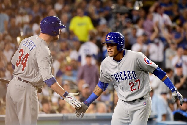 LOS ANGELES, CA - OCTOBER 20:  Addison Russell #27 celebrates with Jon Lester #34 of the Chicago Cubs after hitting a two-run home run in the sixth inning against the Los Angeles Dodgers in game five of the National League Division Series at Dodger Stadium on October 20, 2016 in Los Angeles, California.  (Photo by Harry How/Getty Images)
