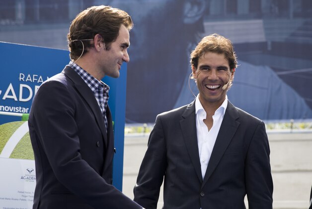 Spanish tennis player Rafael Nadal (R) laughs beside Swiss's player tennis Roger Federer during the opening of the Rafa Nadal Academy in Manacor on October 19, 2016. / AFP / JAIME REINA        (Photo credit should read JAIME REINA/AFP/Getty Images)