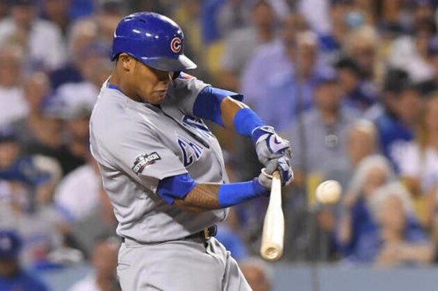 Chicago Cubs' Addison Russell hits a two-run home run off Los Angeles Dodgers relief pitcher Joe Blanton during the sixth inning of Game 5 of the National League baseball championship series Thursday, Oct. 20, 2016, in Los Angeles. (AP Photo/Mark J. Terrill)