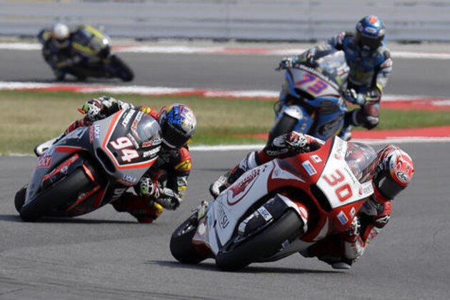 Japan's rider Takaaki Nakagami, bottom right, steers his Kalex on his way to take third place during the San Marino Moto 2 grand prix at the Misano circuit, in Misano Adriatico, Italy, Sunday, Sept. 11, 2016. (AP Photo/Antonio Calanni)