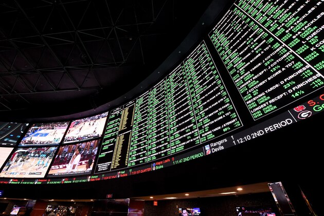 LAS VEGAS, NV - FEBRUARY 02:  The betting line and some of the nearly 400 proposition bets for Super Bowl 50 between the Carolina Panthers and the Denver Broncos are displayed at the Race & Sports SuperBook at the Westgate Las Vegas Resort & Casino on February 2, 2016 in Las Vegas, Nevada. The newly renovated sports book has the world's largest indoor LED video wall with 4,488 square feet of HD video screens measuring 240 feet wide and 20 feet tall.  (Photo by Ethan Miller/Getty Images)
