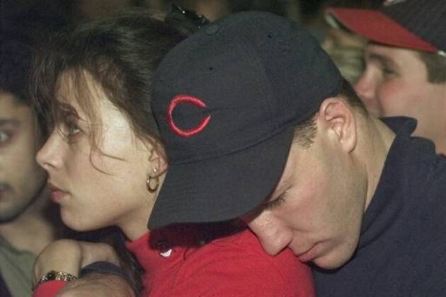 Indians fans sit dejectedly in Pete and Dewey's Planet in Cleveland after the Cleveland Indians lost the World Series 3-2 to the Florida Marlins in an extra-inning game early Monday morning, Oct. 27, 1997 in Miami. (AP Photo/Tony Dejak)