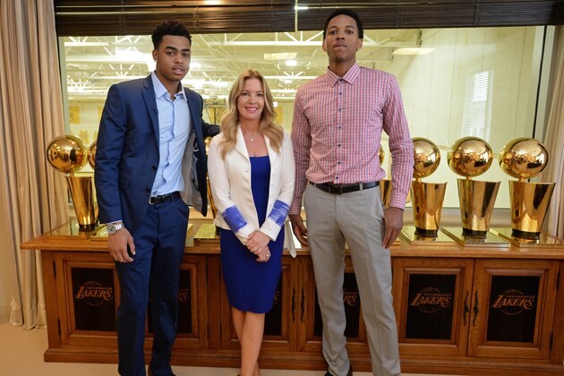 EL SEGUNDO, CA - JUNE 29:  D'Angelo Russell #1 and Anthony Brown #3 of the Los Angeles Lakers pose for a photo with Jeanie Buss, part-owner and president, before they attend a press conference at Toyota Sports Center on June 29, 2015 in El Segundo California.  NOTE TO USER: User expressly acknowledges and agrees that, by downloading and or using this photograph, User is consenting to the terms and conditions of the Getty Images License Agreement. Mandatory Copyright Notice: Copyright 2015 NBAE  (Photo by Andrew D. Bernstein/NBAE via Getty Images)