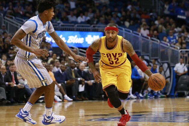 Dec 11, 2015; Orlando, FL, USA; Cleveland Cavaliers guard Mo Williams (52) dribbles the ball as Orlando Magic guard Elfrid Payton (4) defends during the first quarter at Amway Center. Mandatory Credit: Kim Klement-USA TODAY Sports