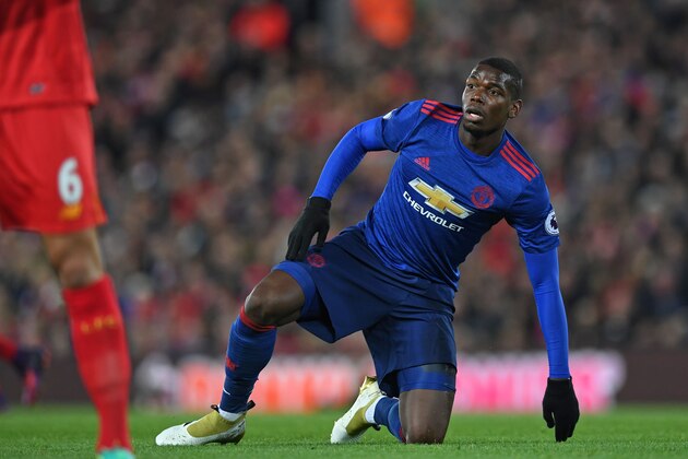 Manchester United's French midfielder Paul Pogba picks himself up off the floor during the English Premier League football match between Liverpool and Manchester United at Anfield in Liverpool, north west England on October 17, 2016.
The game finished 0-0. / AFP / Paul ELLIS / RESTRICTED TO EDITORIAL USE. No use with unauthorized audio, video, data, fixture lists, club/league logos or 'live' services. Online in-match use limited to 75 images, no video emulation. No use in betting, games or single club/league/player publications.  /         (Photo credit should read PAUL ELLIS/AFP/Getty Images)