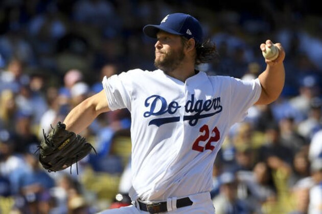 FILE - In this Oct. 11, 2016, file photo, Los Angeles Dodgers starting pitcher Clayton Kershaw throws against the Washington Nationals during the first inning in Game 4 of baseball's National League Division Series in Los Angeles. The Chicago Cubs return home just one win shy of their first World Series appearance in 71 years, and they will have two chances to lock it up, leading the Los Angeles Dodgers 3-2 in the NLCS. The Cubs will send major league ERA champion Kyle Hendricks to the mound on Saturday against Dodgers ace Clayton Kershaw.  (AP Photo/Mark J. Terrill, File)