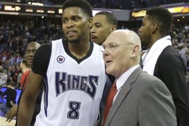 Sacramento Kings forward Rudy Gay congratulates new Kings head coach George Karl after after defeating the Boston Celtics 109-101 in an NBA basketball game in Sacramento, Calif., Friday, Feb. 20, 2015.  Karl was hired earlier in the month to replace Tyrone Corbin.(AP Photo/Rich Pedroncelli)