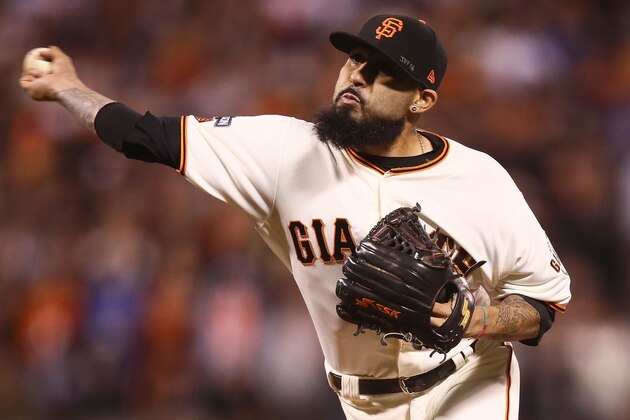 SAN FRANCISCO, CA - OCTOBER 10:  Sergio Romo #54 of the San Francisco Giants delivers a pitch in the ninth inning against the Chicago Cubs during Game Three of their National League Division Series against the Chicago Cubs at AT&T Park on October 10, 2016 in San Francisco, California.  (Photo by Ezra Shaw/Getty Images)