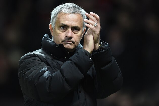 Manchester United's Portuguese manager Jose Mourinho appluads after the final whistle in the UEFA Europa League group A football match between Manchester United and Fenerbahce at Old Trafford in Manchester, north west England, on October 20, 2016. / AFP / OLI SCARFF        (Photo credit should read OLI SCARFF/AFP/Getty Images)