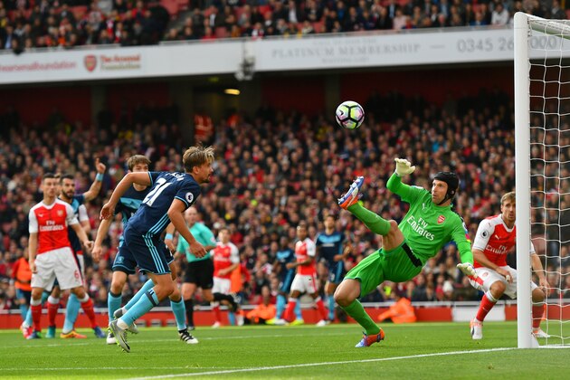 LONDON, ENGLAND - OCTOBER 22:  Petr Cech of Arsenal (R) saves Gaston Ramirez of Middlesbrough (L) header  during the Premier League match between Arsenal and Middlesbrough at Emirates Stadium on October 22, 2016 in London, England.  (Photo by Dan Mullan/Getty Images)