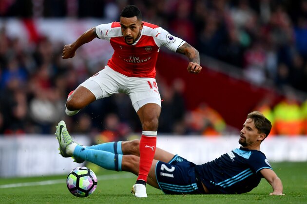 LONDON, ENGLAND - OCTOBER 22:  Theo Walcott of Arsenal and Gaston Ramirez of Middlesbrough compete for the ball during the Premier League match between Arsenal and Middlesbrough at Emirates Stadium on October 22, 2016 in London, England.  (Photo by Dan Mullan/Getty Images)