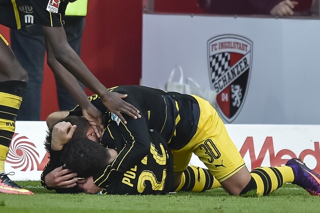 Dortmund's French striker Ousmane Dembele, Dortmund's German defender Felix Passlack and Dortmund's American midfielder Christian Pulisic celebrate the third goal for their team during the German first division Bundesliga football match between FC Ingolstadt 04 and Borussia Dortmund in Ingolstadt, southern Germany, on October 22, 2016. / AFP / GUENTER SCHIFFMANN / RESTRICTIONS: DURING MATCH TIME: DFL RULES TO LIMIT THE ONLINE USAGE TO 15 PICTURES PER MATCH AND FORBID IMAGE SEQUENCES TO SIMULATE VIDEO. == RESTRICTED TO EDITORIAL USE == FOR FURTHER QUERIES PLEASE CONTACT DFL DIRECTLY AT + 49 69 650050
        (Photo credit should read GUENTER SCHIFFMANN/AFP/Getty Images)