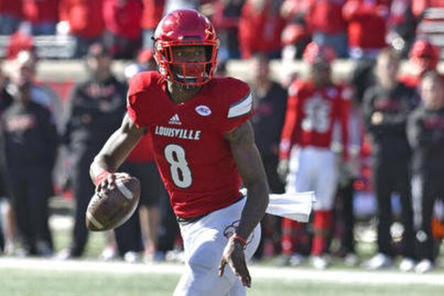 Louisville quarterback Lamar Jackson (8) looks for an open receiver during the first quarter of their NCAA college football game against North Carolina State, Saturday, Oct. 22, 2016, in Louisville, Ky. (AP Photo/Timothy D. Easley)