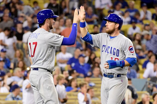 LOS ANGELES, CA - OCTOBER 20: Kris Bryant #17 and Ben Zobrist #18 of the Chicago Cubs celebrate after a three-run double in the eighth inning against the Los Angeles Dodgers in game five of the National League Division Series at Dodger Stadium on October 20, 2016 in Los Angeles, California.  (Photo by Harry How/Getty Images)