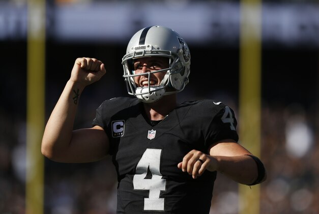 Oct 9, 2016; Oakland, CA, USA; Oakland Raiders quarterback Derek Carr (4) reacts after throwing a touchdown pass against the San Diego Chargers in the third quarter at Oakland Coliseum. The Raiders defeated the Chargers 34-31. Mandatory Credit: Cary Edmondson-USA TODAY Sports