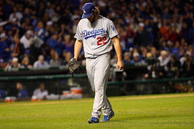CHICAGO, IL - OCTOBER 22:  Clayton Kershaw #22 of the Los Angeles Dodgers walks back to the dugout after the first inning against the Chicago Cubs during game six of the National League Championship Series at Wrigley Field on October 22, 2016 in Chicago, Illinois.  (Photo by Jamie Squire/Getty Images)