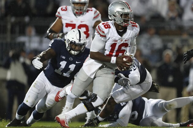 STATE COLLEGE, PA - OCTOBER 22:  J.T. Barrett #16 of the Ohio State Buckeyes is hurried by Brandon Bell #11 of the Penn State Nittany Lions in the first half during the game on October 22, 2016 at Beaver Stadium in State College, Pennsylvania.  (Photo by Justin K. Aller/Getty Images)