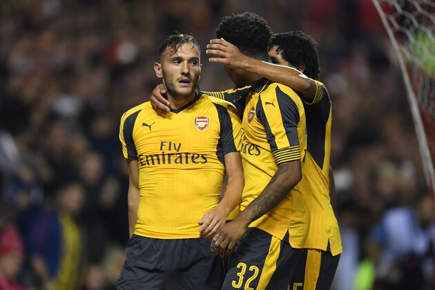 NOTTINGHAM, ENGLAND - SEPTEMBER 20:  Lucas Perez (L) of Arsenal celebrates scoring his team's third goal during the EFL Cup Third Round match between Nottingham Forest and Arsenal at City Ground on September 20, 2016 in Nottingham, England.  (Photo by Shaun Botterill/Getty Images)