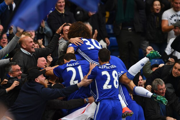 Chelsea's Spanish midfielder Pedro goes into the crowd to celebrate after scoring the opening goal of the English Premier League football match between Chelsea and Manchester United at Stamford Bridge in London on October 23, 2016. / AFP / Ben STANSALL / RESTRICTED TO EDITORIAL USE. No use with unauthorized audio, video, data, fixture lists, club/league logos or 'live' services. Online in-match use limited to 75 images, no video emulation. No use in betting, games or single club/league/player publications.  /         (Photo credit should read BEN STANSALL/AFP/Getty Images)
