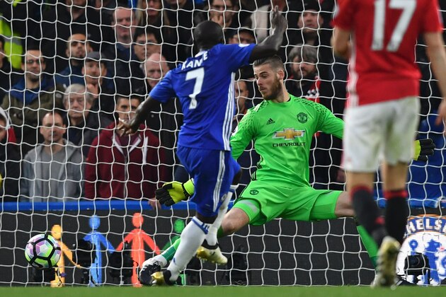 Chelsea's French midfielder N'Golo Kante (L) scores their fourth goal during the English Premier League football match between Chelsea and Manchester United at Stamford Bridge in London on October 23, 2016. / AFP / BEN STANSALL / RESTRICTED TO EDITORIAL USE. No use with unauthorized audio, video, data, fixture lists, club/league logos or 'live' services. Online in-match use limited to 75 images, no video emulation. No use in betting, games or single club/league/player publications.  /         (Photo credit should read BEN STANSALL/AFP/Getty Images)