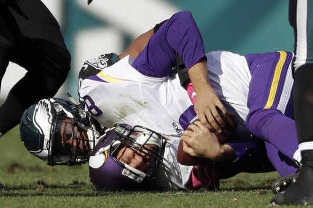 Minnesota Vikings' Sam Bradford (8) is tackled by Philadelphia Eagles' Jordan Hicks during the second half of an NFL football game, Sunday, Oct. 23, 2016, in Philadelphia. (AP Photo/Michael Perez)