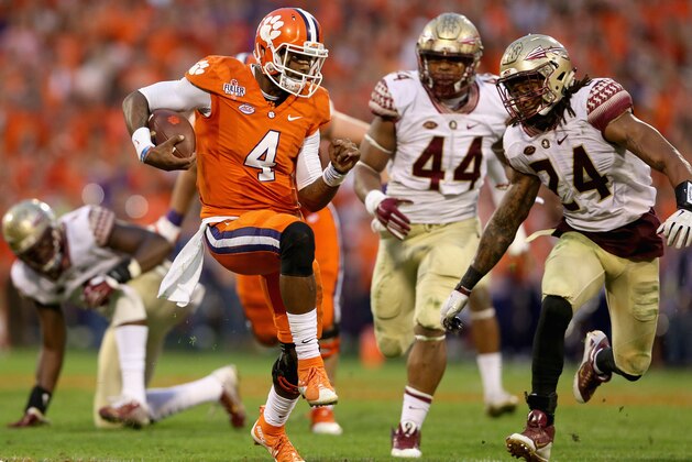 CLEMSON, SC - NOVEMBER 07:  Terrance Smith #24 of the Florida State Seminoles tries to tackle Deshaun Watson #4 of the Clemson Tigers during their game at Memorial Stadium on November 7, 2015 in Clemson, South Carolina.  (Photo by Streeter Lecka/Getty Images)