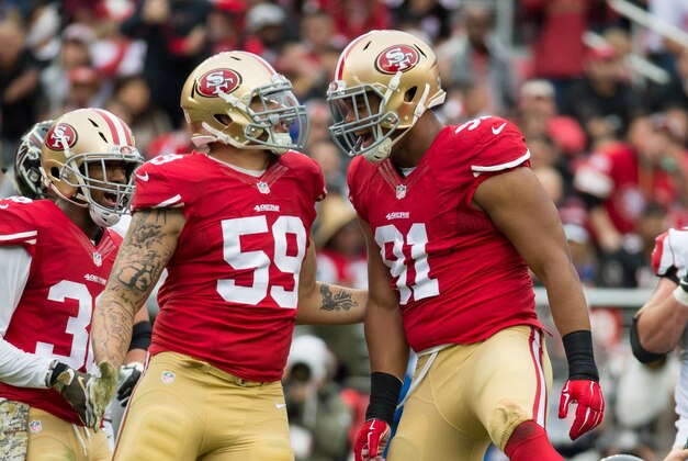 November 8, 2015; Santa Clara, CA, USA; San Francisco 49ers outside linebacker Aaron Lynch (59) and defensive end Arik Armstead (91) celebrate during the first quarter against the Atlanta Falcons at Levi's Stadium. The 49ers defeated the Falcons 17-16. Mandatory Credit: Kyle Terada-USA TODAY Sports
