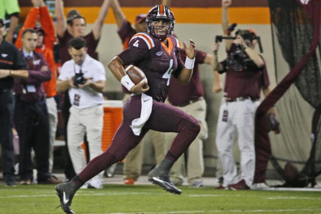 Virginia Tech quarterback Jerod Evans (4) runs for a touchdown during the second half of an NCAA college football game against Miami, at Lane stadium in Blacksburg, Va., Thursday, Oct. 20, 2016. Virginia Tech defeated Miami 37-16. (AP Photo/Steve Helber)